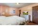 Cozy bedroom featuring soft lighting, a comfortable bed, and a calming ambiance at 245 Cedar Crk Rd, Franklinton, NC 27525