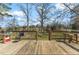 View from the wooden deck overlooking the serene backyard and green space at 245 Cedar Crk Rd, Franklinton, NC 27525