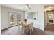 Bright dining area with access to an outdoor deck, table set and reflective wall mirror at 245 Cedar Crk Rd, Franklinton, NC 27525