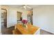 Cozy dining room with a simple table and bench seating arrangement, featuring a ceiling fan at 245 Cedar Crk Rd, Franklinton, NC 27525