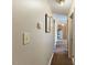 Hallway with neutral paint, contrasting trim, and doorways leading to various rooms at 245 Cedar Crk Rd, Franklinton, NC 27525