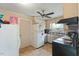 Modest kitchen with essential appliances, neutral cabinets, and a practical layout for cooking at 245 Cedar Crk Rd, Franklinton, NC 27525