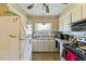 Functional kitchen area with appliances, a window above the sink, and essential storage space at 245 Cedar Crk Rd, Franklinton, NC 27525