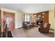Comfortable living room with fireplace, cozy seating, and a view to the adjacent dining area at 245 Cedar Crk Rd, Franklinton, NC 27525