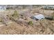 Aerial view of the property showing a large barn surrounded by trees at 2490 Earpsboro Rd, Zebulon, NC 27597