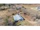 Aerial view of a large barn on property with surrounding farmland at 2490 Earpsboro Rd, Zebulon, NC 27597