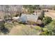 Beautiful home surrounded by manicured lawns and mature trees, creating a private and serene oasis at 2490 Earpsboro Rd, Zebulon, NC 27597