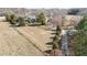 Expansive land with a well-maintained home, lush trees, and a long driveway leading to the residence at 2490 Earpsboro Rd, Zebulon, NC 27597