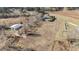 Expansive land with outbuilding, well-maintained home, lush trees, and open space at 2490 Earpsboro Rd, Zebulon, NC 27597