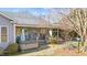 A large covered patio with comfortable seating and a relaxing hot tub at 2490 Earpsboro Rd, Zebulon, NC 27597