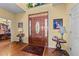 Welcoming foyer with hardwood floors, a decorative front door, and elegant decor at 2490 Earpsboro Rd, Zebulon, NC 27597
