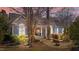 Charming home featuring a welcoming front porch, tasteful landscaping, and serene exterior lighting at 2490 Earpsboro Rd, Zebulon, NC 27597