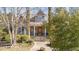 Inviting home featuring a cozy front porch, lovely landscaping, and a classic design at 2490 Earpsboro Rd, Zebulon, NC 27597