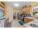 The kitchen boasts stainless steel appliances, wood cabinets, and marble countertops at 2490 Earpsboro Rd, Zebulon, NC 27597