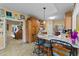 Kitchen island features marble countertops, barstool seating, and wood cabinets at 2490 Earpsboro Rd, Zebulon, NC 27597
