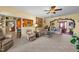 Inviting living room features a front door entrance, comfortable couches, and a view into the kitchen at 2490 Earpsboro Rd, Zebulon, NC 27597