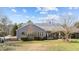 Charming home featuring a cozy covered deck and landscaped backyard at 2490 Earpsboro Rd, Zebulon, NC 27597