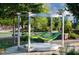 A pair of green hammocks hang beneath a metal structure in the park at 2806 Kempthorne Rd # 62, Cary, NC 27519