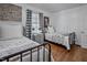 Shared bedroom with hardwood floors and matching twin beds at 2836 Oberlin Rd, Raleigh, NC 27608