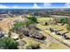 Sprawling aerial view of the property, surrounded by trees, a pond, and community buildings and features at 2867, 2851 Nc-210 & Galilee Hwy, Smithfield, NC 27577
