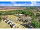 Extensive aerial perspective of the property, displaying its setting among trees, lawns, and local roadways at 2867, 2851 Nc-210 & Galilee Hwy, Smithfield, NC 27577
