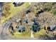 An aerial view of a neighborhood showcasing houses, mature trees, and lawns at 2867, 2851 Nc-210 & Galilee Hwy, Smithfield, NC 27577