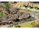 A captivating aerial view of a plot of land with trees and a road running along the side at 2867, 2851 Nc-210 & Galilee Hwy, Smithfield, NC 27577