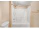 Bathroom featuring a shower and tub combination, tiled walls and a toilet at 2867, 2851 Nc-210 & Galilee Hwy, Smithfield, NC 27577