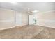 Spacious bedroom with neutral paint, ceiling fan, and connecting access to the bathroom at 2867, 2851 Nc-210 & Galilee Hwy, Smithfield, NC 27577