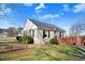 Well-maintained home features a fenced yard with lush shrubbery and mature trees, offering privacy at 2867, 2851 Nc-210 & Galilee Hwy, Smithfield, NC 27577