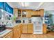 Kitchen includes wooden cabinetry and appliances, with natural light from the window at 2867, 2851 Nc-210 & Galilee Hwy, Smithfield, NC 27577