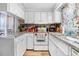 Cozy kitchen featuring white cabinets, neutral counters, and modern appliances at 2867, 2851 Nc-210 & Galilee Hwy, Smithfield, NC 27577