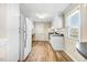 Functional kitchen with white cabinets, stainless steel appliances, and a window at 2867, 2851 Nc-210 & Galilee Hwy, Smithfield, NC 27577