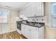 Compact kitchen with white cabinets and drawers, providing ample storage at 2867, 2851 Nc-210 & Galilee Hwy, Smithfield, NC 27577