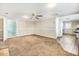 Spacious living room with neutral paint, ceiling fan, and views into the kitchen at 2867, 2851 Nc-210 & Galilee Hwy, Smithfield, NC 27577
