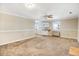Cozy living room with ceiling fan, neutral paint, and connecting access to the kitchen at 2867, 2851 Nc-210 & Galilee Hwy, Smithfield, NC 27577