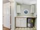 Utility room with a water heater, window, and cabinetry at 2867, 2851 Nc-210 & Galilee Hwy, Smithfield, NC 27577