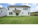 Spacious backyard showcasing the home's rear exterior and lush green lawn at 302 Umstead St, Sanford, NC 27330