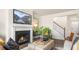 Inviting living room with a cozy fireplace, bright windows, and comfortable seating at 302 Umstead St, Sanford, NC 27330