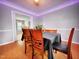 Cozy dining room with hardwood floors, modern ceiling accent lights, and warm atmosphere at 401 Maymount Dr, Durham, NC 27703