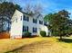 Well-manicured lawn and landscaping surround this traditional two-story home at 401 Maymount Dr, Durham, NC 27703