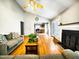 Bright and airy living room featuring hardwood floors, fireplace, and open floorplan at 401 Maymount Dr, Durham, NC 27703