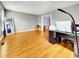Spacious living room with hardwood floors, gray walls, computer desk, and natural light at 401 Maymount Dr, Durham, NC 27703