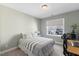 Comfortable bedroom featuring carpeted floors, a window providing natural light, and soothing neutral wall colors at 415 Mariah Towns Way, Garner, NC 27529
