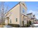 Attractive multi-story townhome with neutral siding, well maintained bushes and shrubs, and dark roof at 415 Mariah Towns Way, Garner, NC 27529