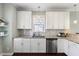 Kitchen featuring white cabinets, stainless steel appliances, tile backsplash and granite countertops at 415 Mariah Towns Way, Garner, NC 27529