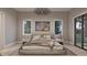 Bedroom with a large bed, soft lighting and a large window at 4308 Windsor Pl, Raleigh, NC 27609