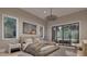 A spacious bedroom with neutral colors and a decorative lighting fixture at 4308 Windsor Pl, Raleigh, NC 27609