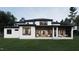 Expansive backyard view showcasing the covered patios and modern home design at 4308 Windsor Pl, Raleigh, NC 27609
