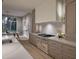 Gourmet kitchen showcasing stainless steel appliances, custom cabinetry, and seamless transition to the dining area at 4308 Windsor Pl, Raleigh, NC 27609